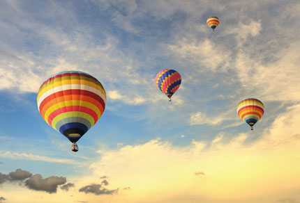 Colourful hot air balloons in the sky.